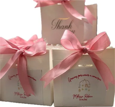 Cajitas de agradecimiento con moño rosa